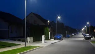 small city street with modern LED streetlights at night