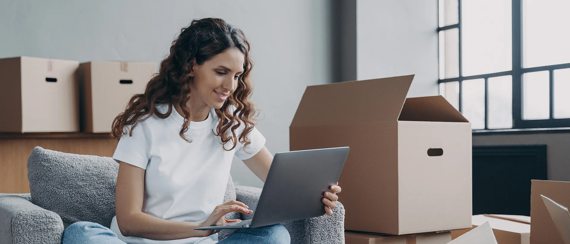 Happy young woman selling or purchasing apartment online. Investment and internet banking.