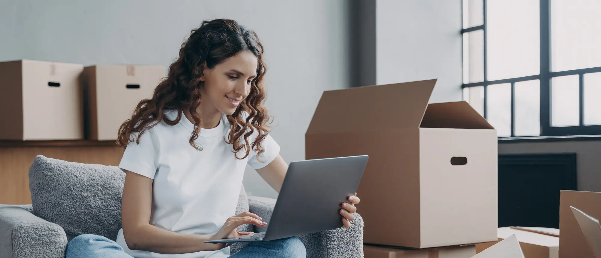 Happy young woman selling or purchasing apartment online. Investment and internet banking.